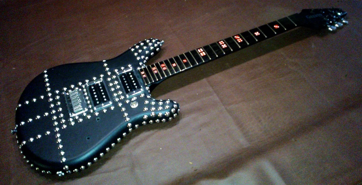 Finished black studded Gelvin OPS guitar built for Andrew Dice Clay
